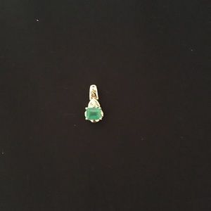 Ladies Emerald cut .25 ct emerald set in 14kt gold